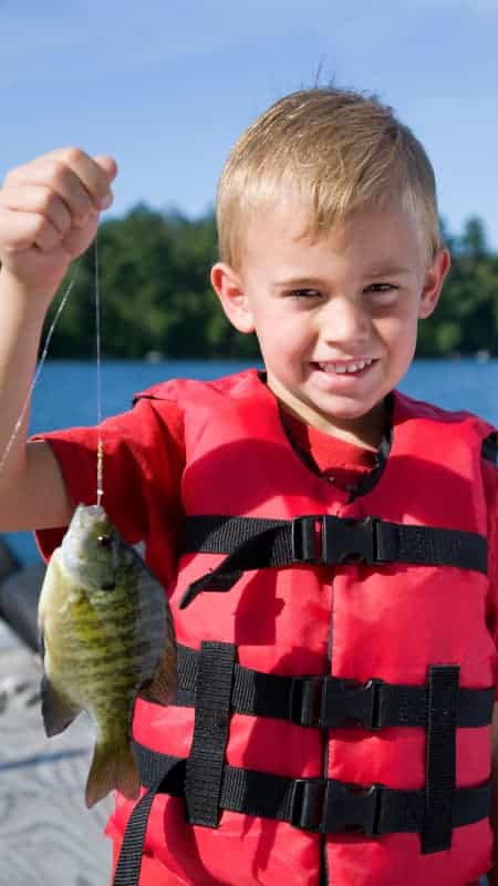 Young boy with a fish